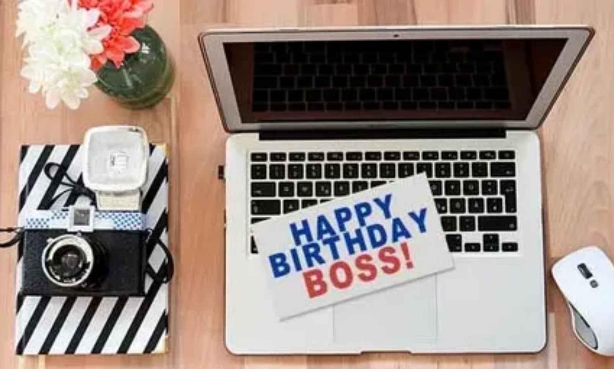 Professional birthday wishes for boss card on office desk with pen and envelope