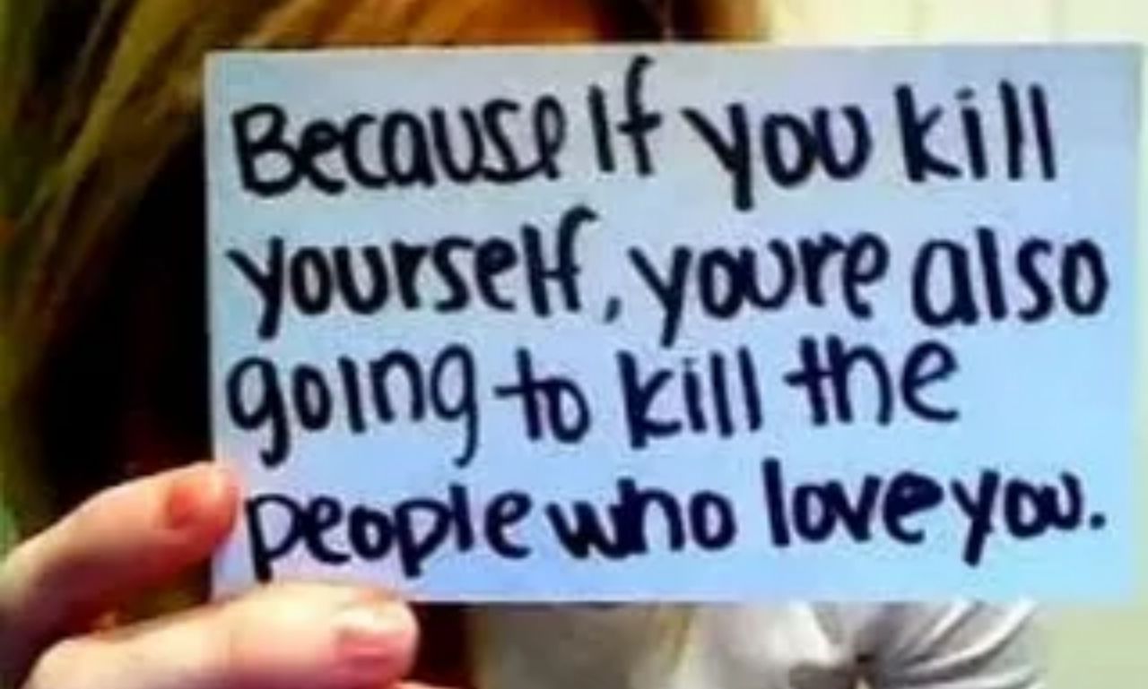 Person standing at sunrise with hands raised in prayer symbolizing hope, healing, and emotional resilience