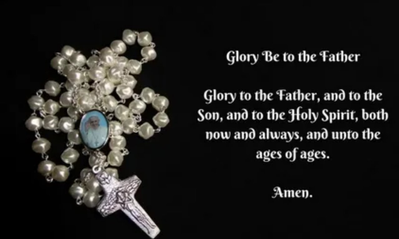 Open Bible with a glowing cross and praying hands symbolizing a powerful prayer for vocations, God's calling, faith, guidance, and spiritual discernment.