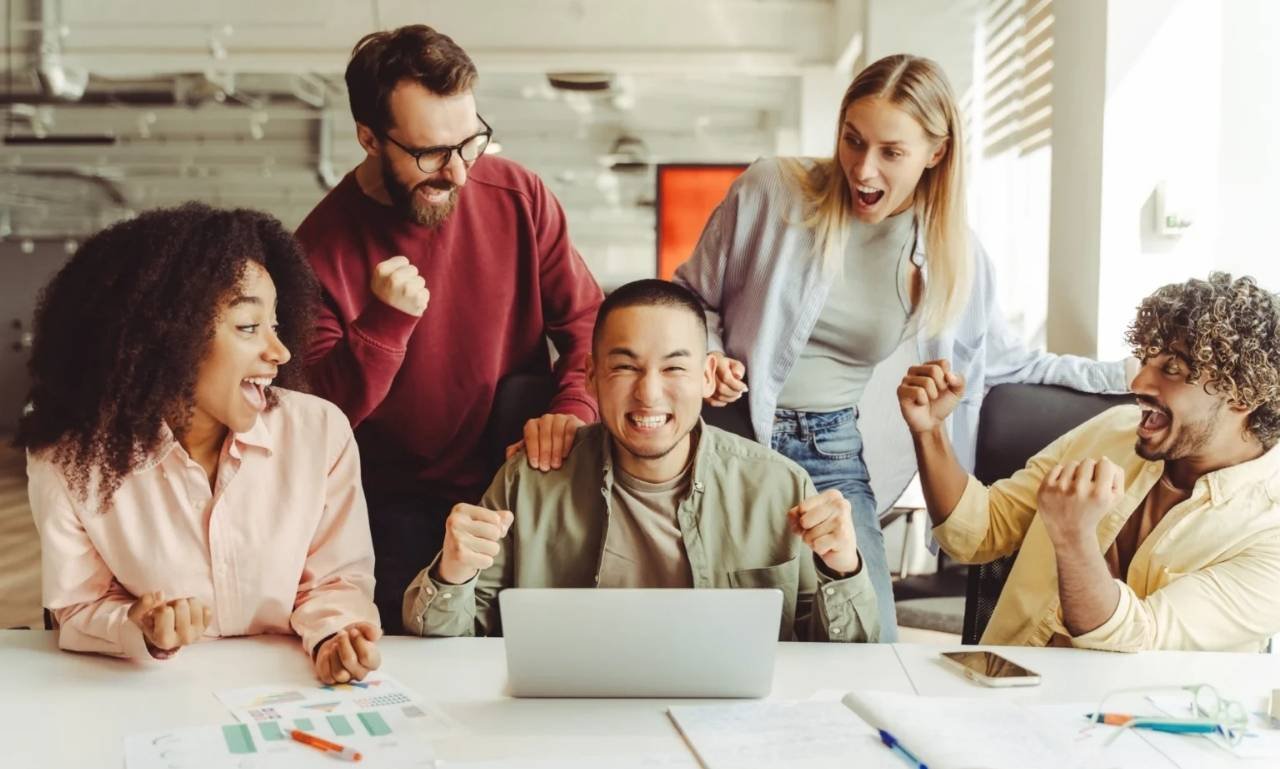 Inspirational funny work quotes displayed in a cheerful office setting with coworkers, coffee mugs, laptops, and a positive workplace atmosphere that promotes laughter, teamwork, and motivation.