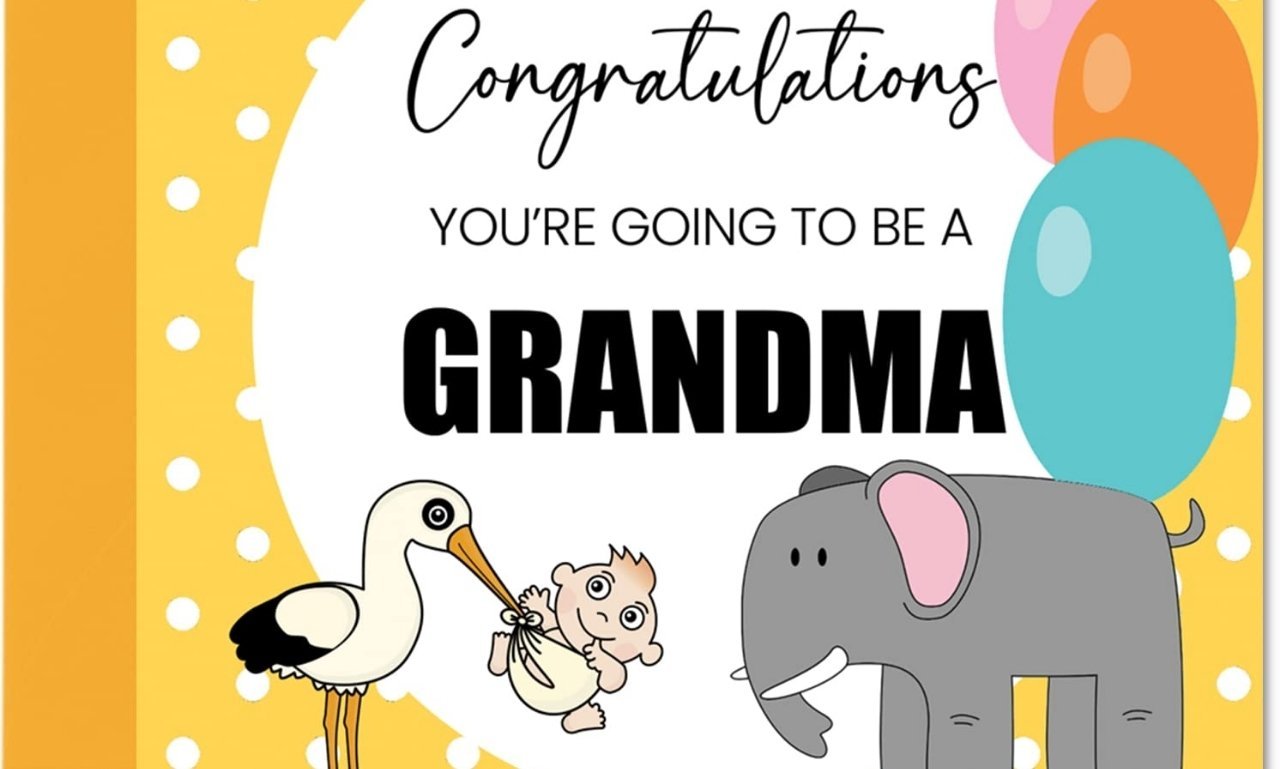 Smiling new grandmother holding her newborn grandchild with a joyful family celebrating, representing congratulations on becoming a grandma to share joy.