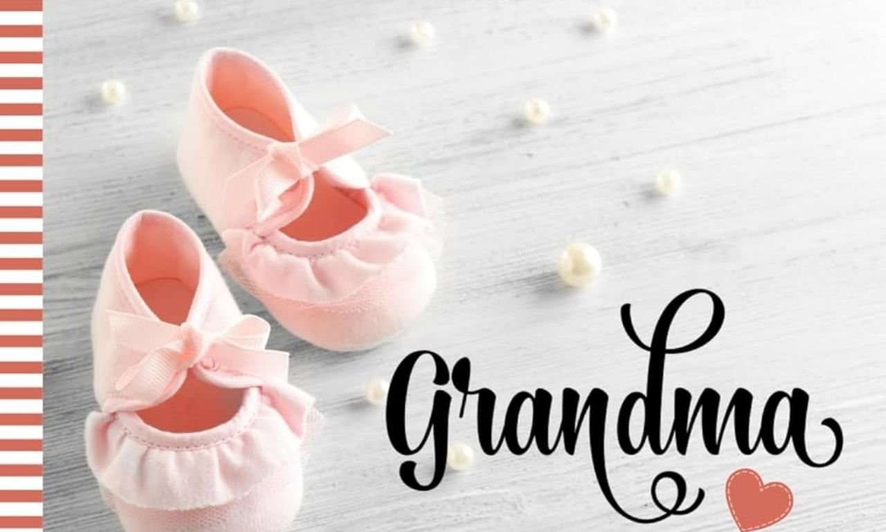 Smiling new grandmother holding her newborn grandchild with a joyful family celebrating, representing congratulations on becoming a grandma to share joy.
